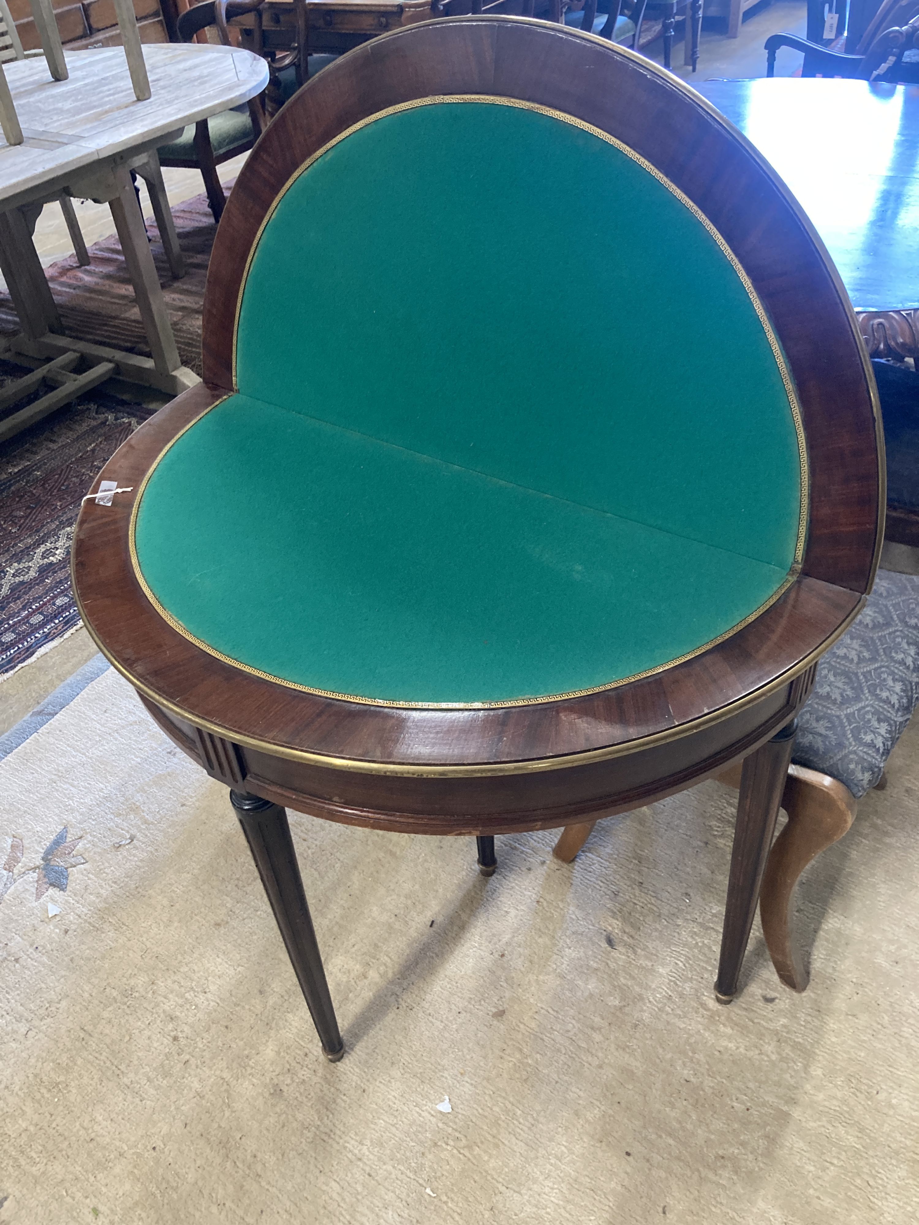 An early 20th century French brass mounted mahogany D shape folding card table, width 91cm, depth 46cm, height 75cm
